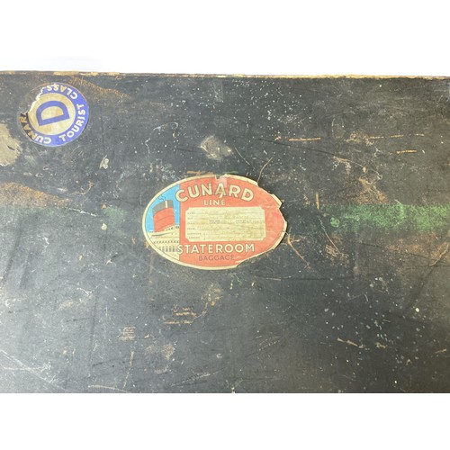 286 - A vintage travel trunk with Cunard travel labels.