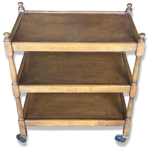 287 - An Oak three-tier tea Trolley, raised on original casters.
77cm Tall