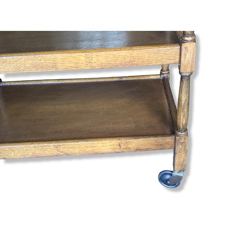 287 - An Oak three-tier tea Trolley, raised on original casters.
77cm Tall