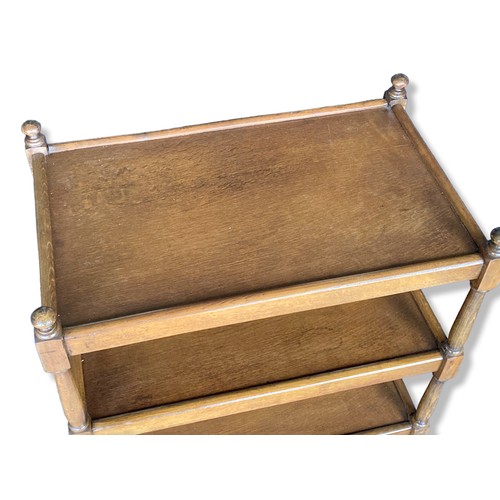 287 - An Oak three-tier tea Trolley, raised on original casters.
77cm Tall