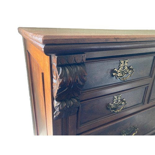 314 - A 19th-Century Mahogany Scotch Chest of Drawers. With carved finials. Square central drawer bordered... 