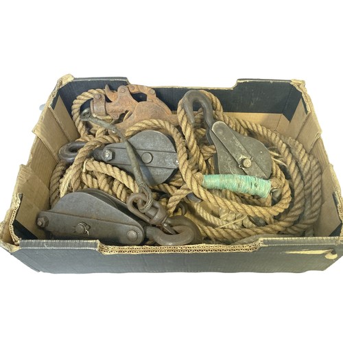 402 - A box of vintage heavy duty Ropes & Cast Iron Pulleys.