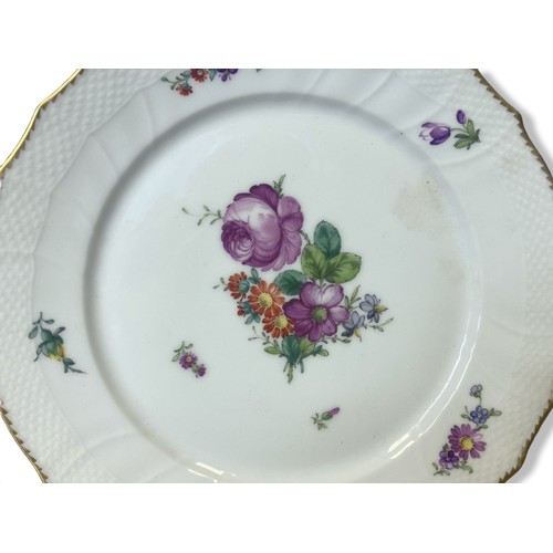 147 - A Hand-painted Royal Copenhagen porcelain plate.  Painted with a colourful spray of flowers.
23.5cm ... 