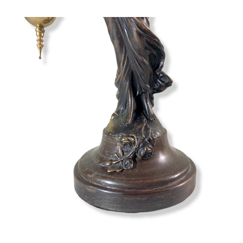 154 - Early 20th Century Junghans mystery clock. Spelter maiden holding aloft Gilt-metal clock.
34cm Tall