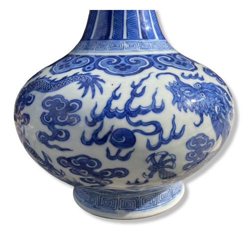 238 - A Chinese Qing porcelain vase. Depicting Two 5-claw Dragons Chasing a Pearl amongst clouds and above... 