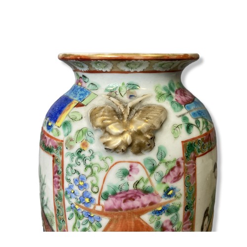 241 - A 19th-Century Chinese Famille Rose porcelain vase. Overglaze enamels painted panels with stylised F... 