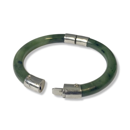 229 - A Chinese white metal & Jade hinged bangle.
7.5cm Diameter.