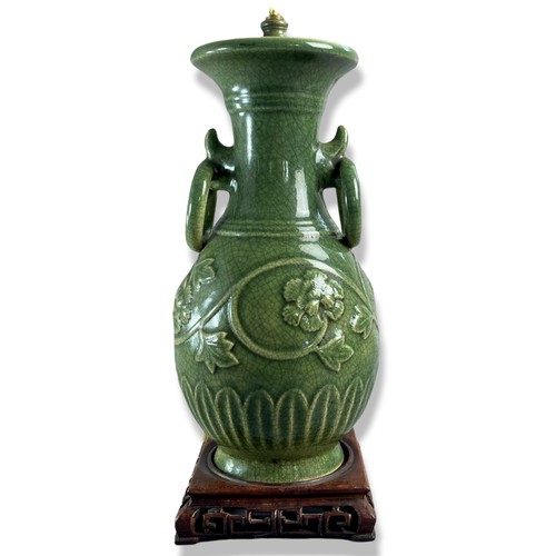 256 - Chinese Longquan Celadon porcelain table lamp vase. Relief decorated with scrolling floral motif. 
3... 