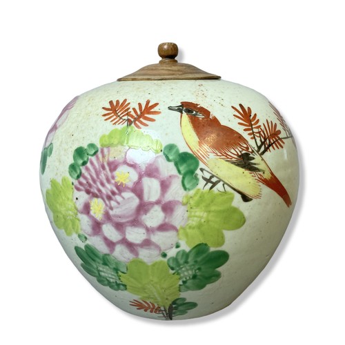 261 - A hand painted Chinese porcelain Jar & cover. Depicting a bird perched amongst enamel blossoming flo... 