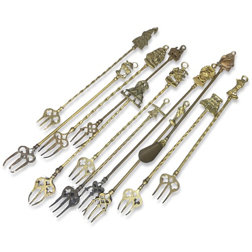 275 - A collection of Twelve various Brass toasting forks.