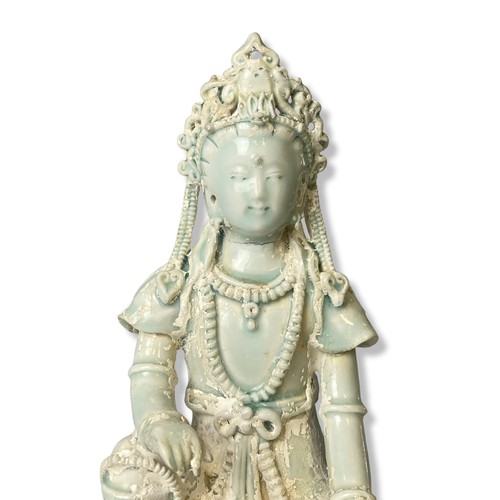 264 - A Chinese Qingbai Celadon porcelain Guanyin. Seated on a Lotus throne. Adorned with beaded jewellery... 