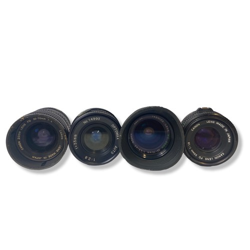 93 - A collection of four vintage camera lenses. Includes a Canon 50mm, Canon 35-70mm Zoom lens, Optomax ... 