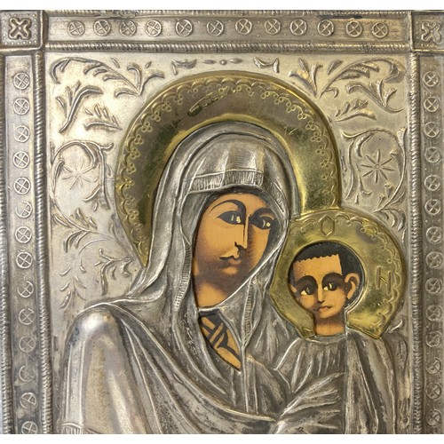 181 - A Russian silver plate Icon. Depicting Smolensk Mother of God.
13 x 10.5cm