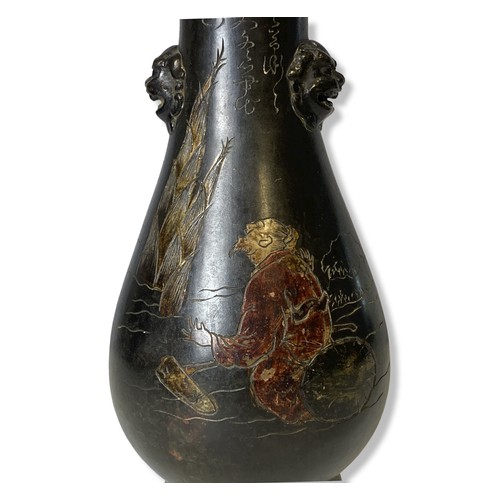 109 - A Japanese incised polychrome Bronze vase. Inscribed with text to neck. Meiji period.
28cm tall