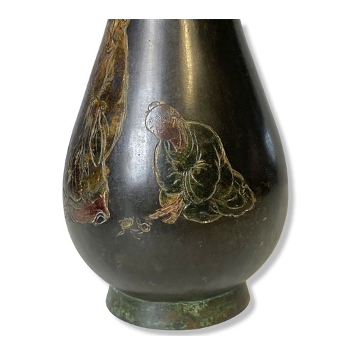 109 - A Japanese incised polychrome Bronze vase. Inscribed with text to neck. Meiji period.
28cm tall