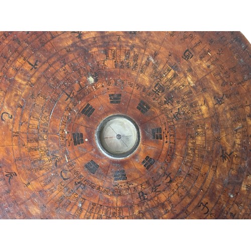 62 - A wooden Chinese Luopan (Feng Shui) compass. 
21 cm Diameter