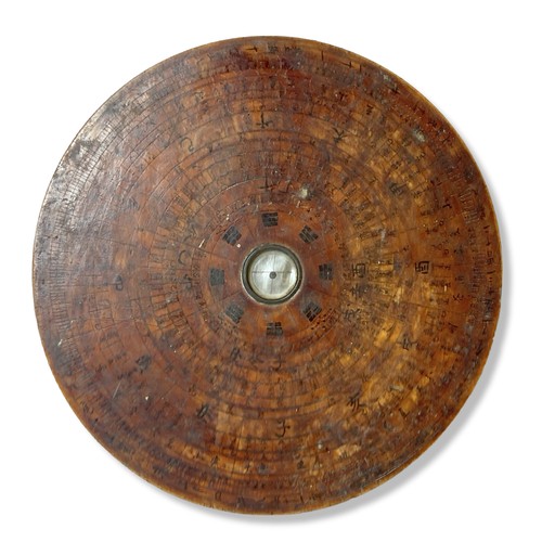 62 - A wooden Chinese Luopan (Feng Shui) compass. 
21 cm Diameter