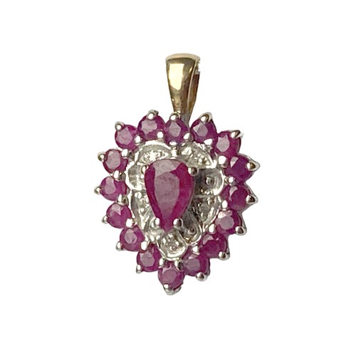 24 - A 9CT Gold, Ruby & Diamond pendant. With a central Pear cut Ruby with 16 surround Rubies and accent ... 