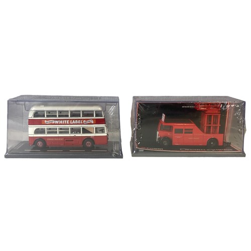 31 - A collection of boxed Diecast model buses and lorries.