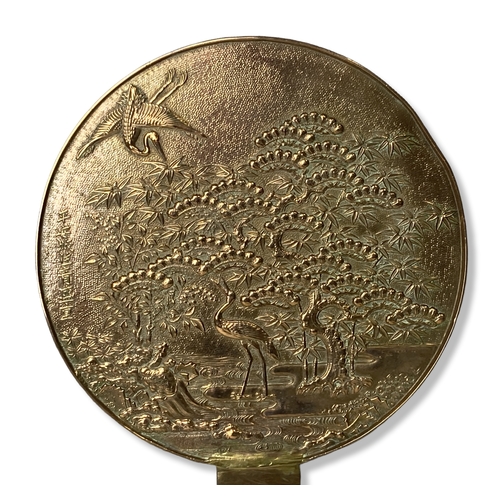 113 - A large Chinese Bronze hand mirror. Depicting a large Blossoming tree with Cranes and a Dragon turtl... 