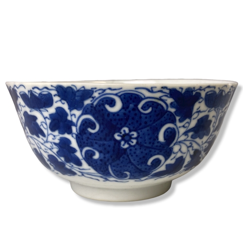 202 - A hand painted Chinese porcelain blue & white bowl, with stylised blossoming floral motifs. Signed t... 