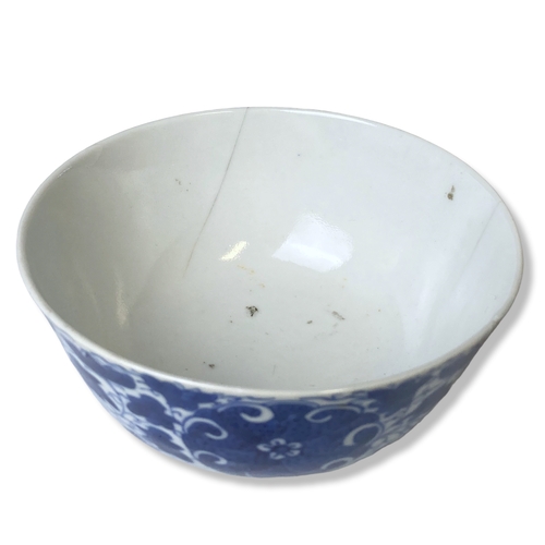 202 - A hand painted Chinese porcelain blue & white bowl, with stylised blossoming floral motifs. Signed t... 