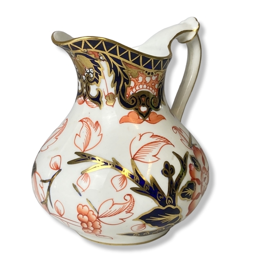 119 - A Royal Crown Derby milk Jug together with RCD petal shape 