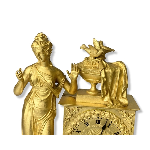 186 - A French Gilt Metal mantle clock. Classical design. Movement, striking on bell. 
35.5cm Tall.