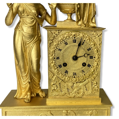 186 - A French Gilt Metal mantle clock. Classical design. Movement, striking on bell. 
35.5cm Tall.