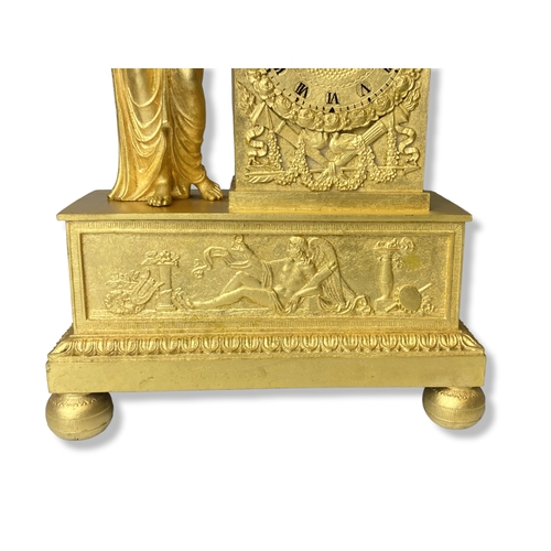 186 - A French Gilt Metal mantle clock. Classical design. Movement, striking on bell. 
35.5cm Tall.