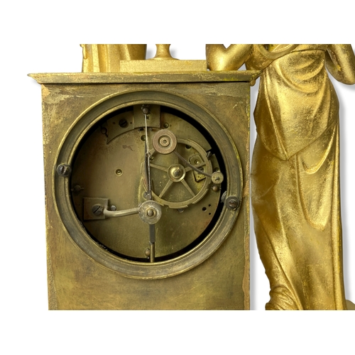 186 - A French Gilt Metal mantle clock. Classical design. Movement, striking on bell. 
35.5cm Tall.