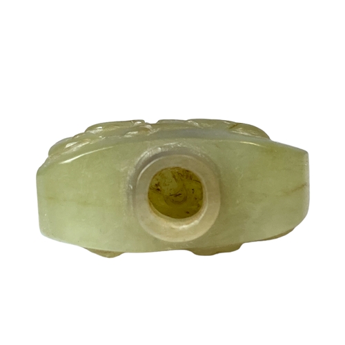 111 - A carved Chinese Jade snuff bottle. 
5 x 4.5 cm