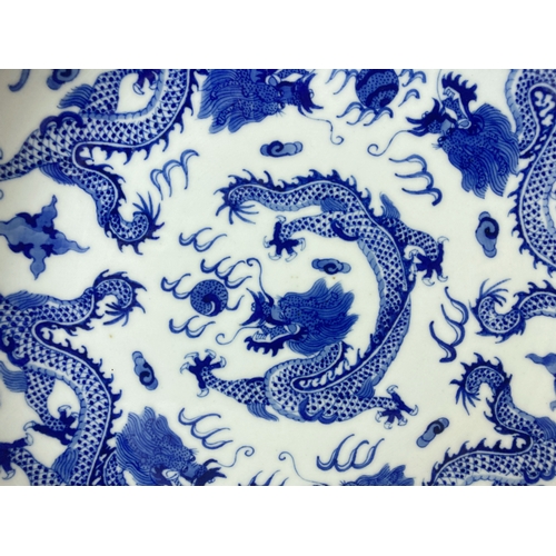 206 - A Chinese porcelain hand painted Blue & white Dish.  With Yongzheng reign mark. Depicting Numerous 5... 