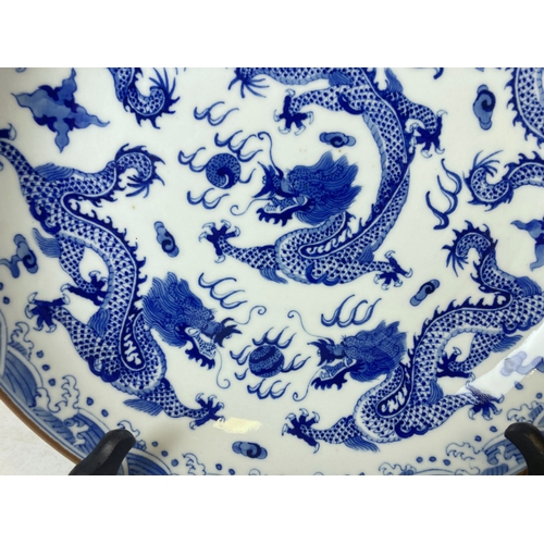 206 - A Chinese porcelain hand painted Blue & white Dish.  With Yongzheng reign mark. Depicting Numerous 5... 