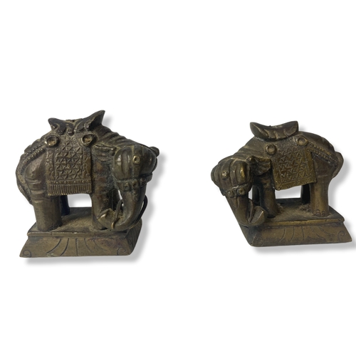 65 - A pair of Chinese Bronze Elephant Opium weights.
5 and 4.5cm tall.