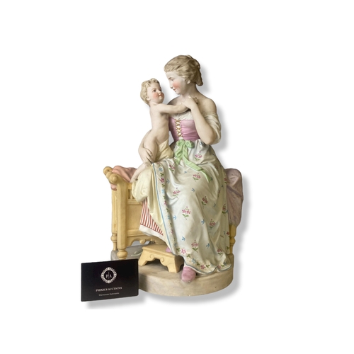 133 - A large Continental Biscuit porcelain figure group. Depicting a hand-painted Mother & Child. marks t... 