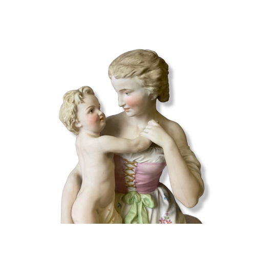 133 - A large Continental Biscuit porcelain figure group. Depicting a hand-painted Mother & Child. marks t... 