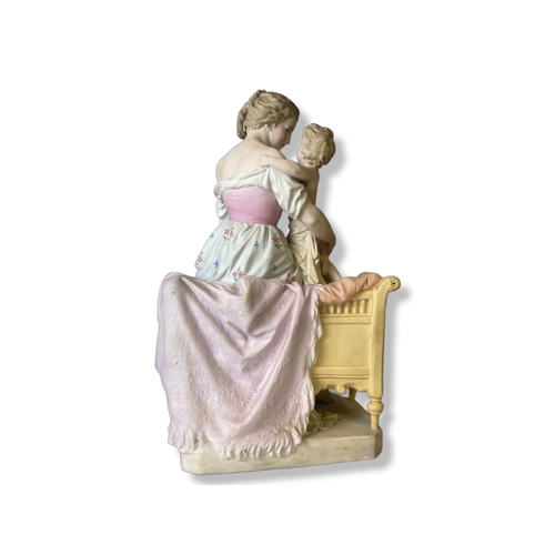 133 - A large Continental Biscuit porcelain figure group. Depicting a hand-painted Mother & Child. marks t... 