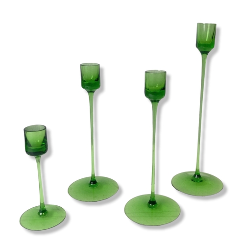 37 - A collection of green Wedgwood candlesticks, together with small Bohemian vases.