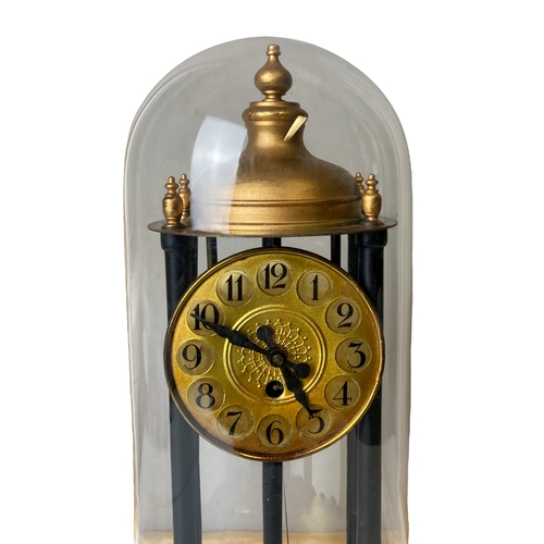 194 - A Glass domed Torsion Anniversary Bandstand clock. With Disc pendulum.
38cm Tall.