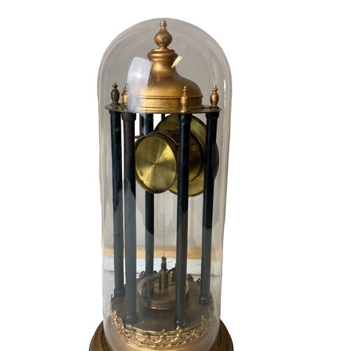 194 - A Glass domed Torsion Anniversary Bandstand clock. With Disc pendulum.
38cm Tall.