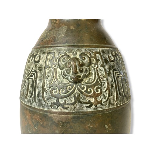 163 - A Ming dynasty Chinese Bronze Archaic Bronze vase. Decorated with relief Taotie masks in carved band... 