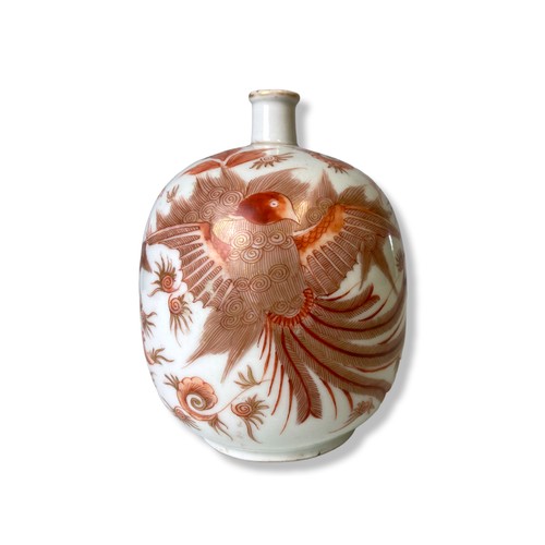 210B - A fine quality porcelain bottle vase painted in Iron red, depicting a rising Phoenix with stylised f... 