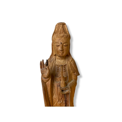 112 - A Chinese carved wood figure of Guanyin.