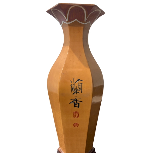 115 - A pair of signed Chinese Bamboo vases. Hand-carved and painted. 
20cm tall