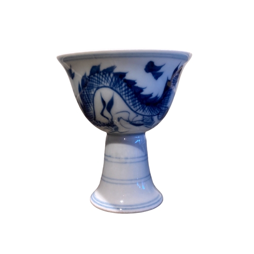 128 - A signed Chinese porcelain Stem cup. Hand painted Dragon chasing pearl.
9 x 8cm