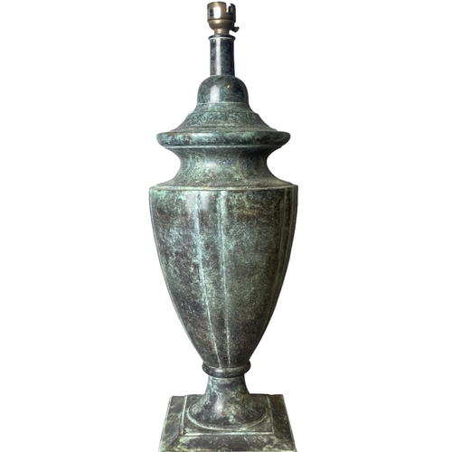 196 - A Bronzed cast iron table lamp. Classical shape.