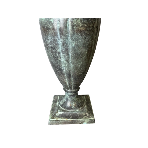 196 - A Bronzed cast iron table lamp. Classical shape.