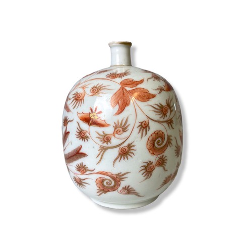 152 - A fine quality porcelain bottle vase painted in Iron red, depicting a rising Phoenix with stylised f... 