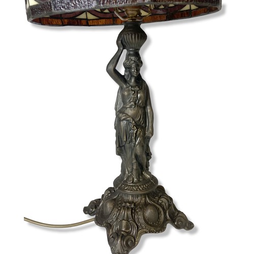 199 - A bronzed metal Tiffany style table lamp. Base in classical lady form. 
55cm tall